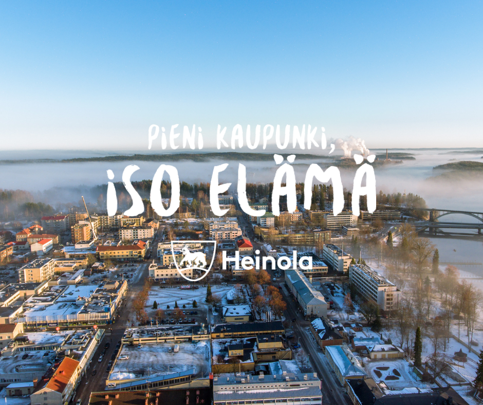 Talvinen maisema ja Heinola-logo