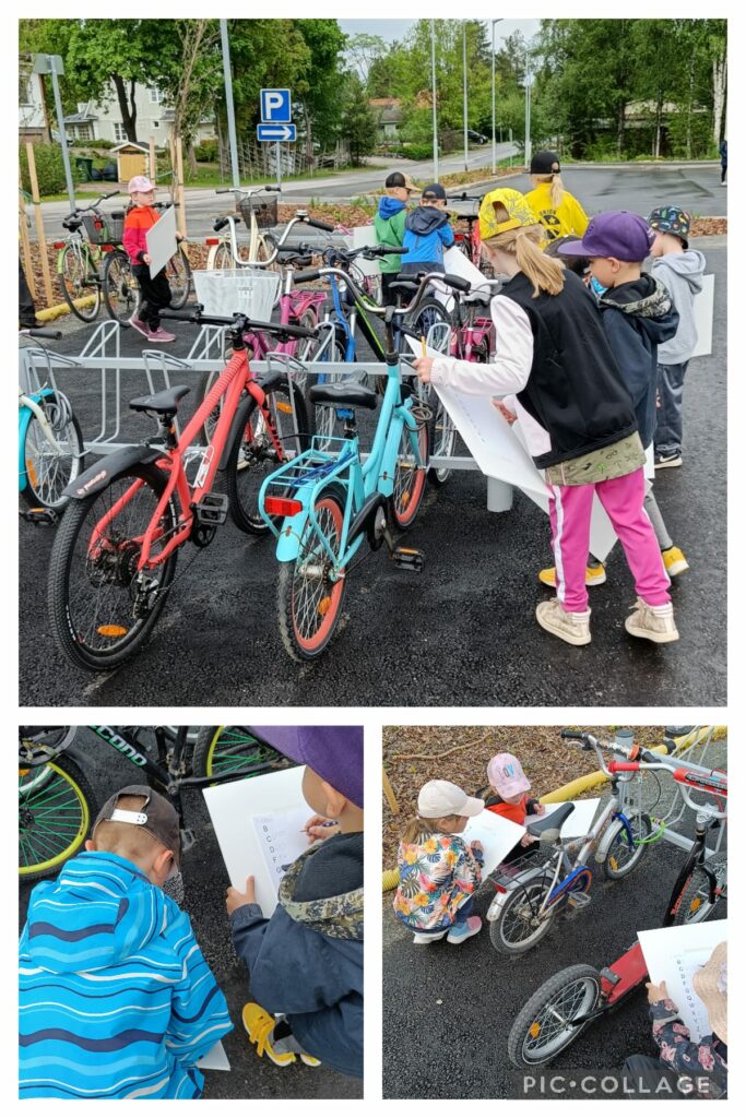 Lapset etsivät ja jäljentävät kirjaimia polkupyöristä