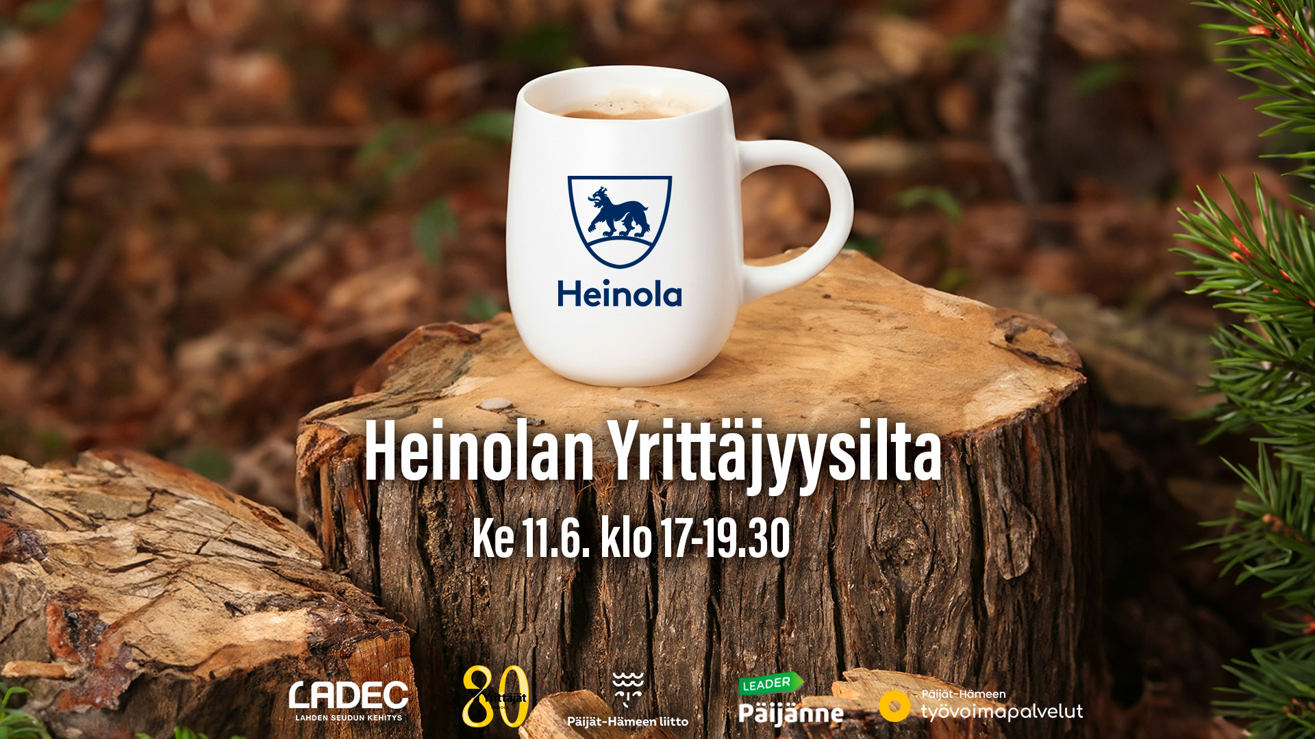 Kuvassa Heinola-aiheinen kahvikuppi kannolla, sekä Yrittäjyysillan yhteistyökumppanien logot.